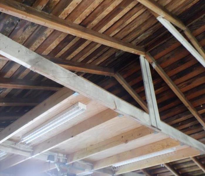 Opened ceiling to reveal roof damage 